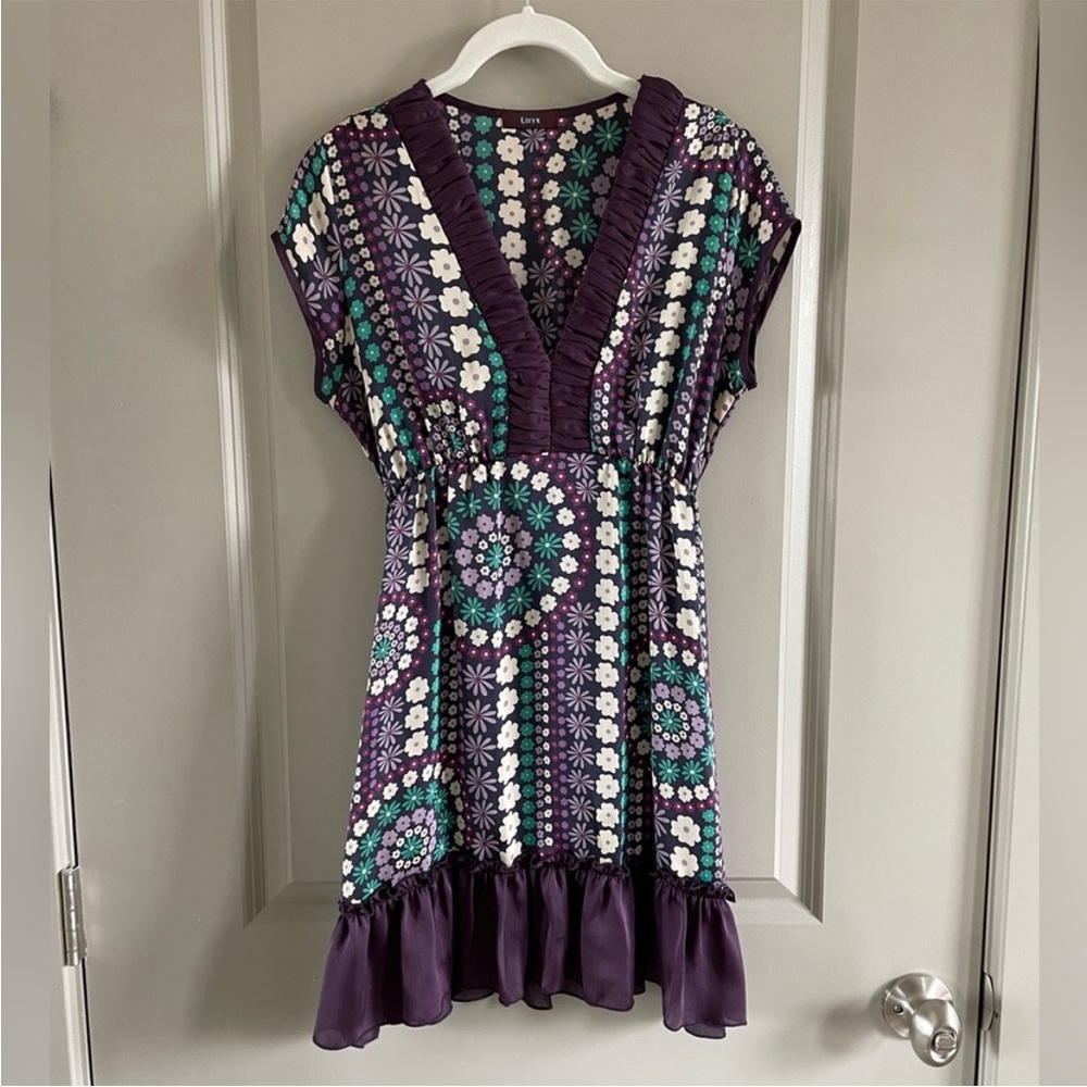 Unyx purple flower tunic. It is a bit sheer, you can see in the 4th picture